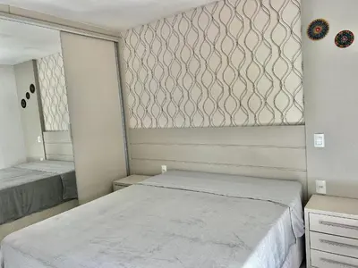 Uma cama ou camas num quarto em Piscina vista mar! Apto na praia de Palmas - AE02J