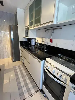 A cozinha ou kitchenette de apartamento quadra mar rua 4100