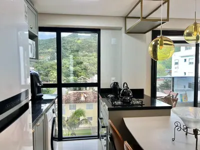 A cozinha ou kitchenette de Lindo! Apto na praia de Palmas! AA03J
