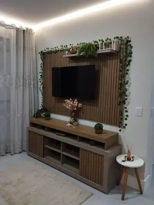 Uma televisão e/ou sistema de entretenimento em Ilumini Apartment