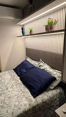 Uma cama ou camas num quarto em Apartamento aconchegante praia de palmas