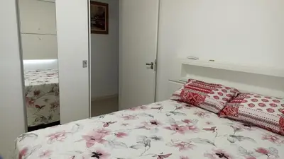 Uma cama ou camas num quarto em Apartamento, Temporada Itapema sc