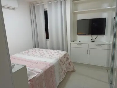 Uma cama ou camas num quarto em Apartamento, Temporada Itapema sc
