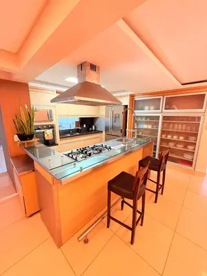 A cozinha ou kitchenette de Penthouse na Av Atlântica with Sea Front and Spa