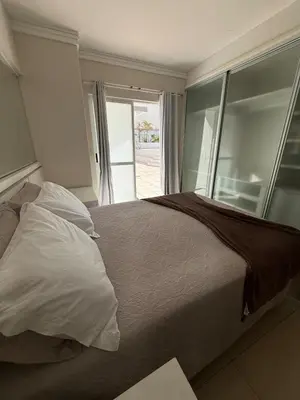 Uma cama ou camas num quarto em Penthouse na Av Atlântica with Sea Front and Spa
