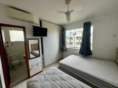 Uma cama ou camas num quarto em Apartamento confortável para família 2