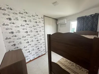 Uma cama ou camas num quarto em Apartamento confortável para família 2