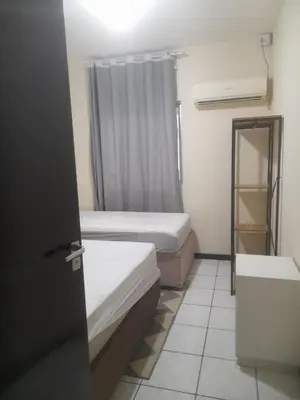 Uma cama ou camas num quarto em Condomínio Residencial Eberle - APTO 401