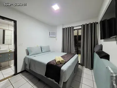 Uma cama ou camas num quarto em Apt 3 Quartos 1 minuto da praia em Itapema