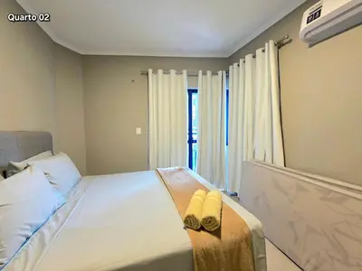 Uma cama ou camas num quarto em Apt Novo a poucos passos do mar em Meia Praia