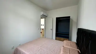 Uma cama ou camas num quarto em Apto Da Praia 201