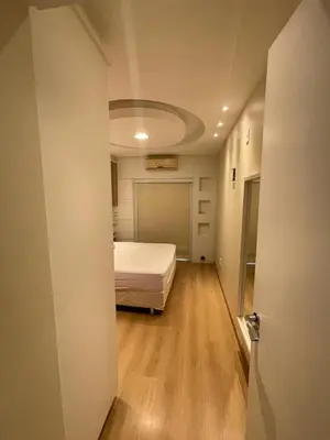Uma cama ou camas num quarto em Apto de 2 Quartos em Meia Praia
