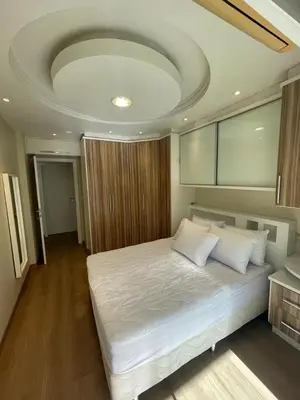 Uma cama ou camas num quarto em Apto de 2 Quartos em Meia Praia
