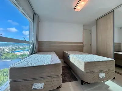 Uma cama ou camas num quarto em Apartamento Beira Mar