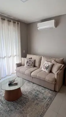 Uma área de estar em Beach House Palmas