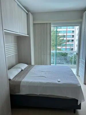 Uma cama ou camas num quarto em VISTA MAR INDESCRITÍVEL em APTO 3 SUÍTES - ITAPEMA - SC