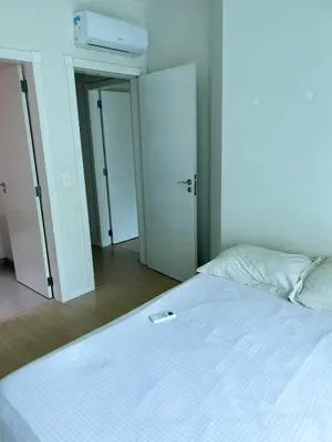 Uma cama ou camas num quarto em VISTA MAR INDESCRITÍVEL em APTO 3 SUÍTES - ITAPEMA - SC