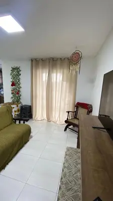Uma televisão e/ou sistema de entretenimento em Apartamento Vista Mar - ITAPEMA SC Praia Central