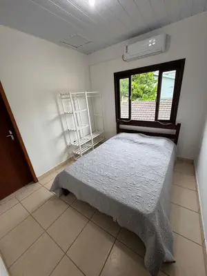 Uma cama ou camas num quarto em Casa com Piscina em Bombinhas