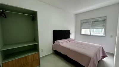 Uma cama ou camas num quarto em apartamento praia de Palmas angel 202