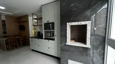 A cozinha ou kitchenette de apartamento praia de Palmas angel 202