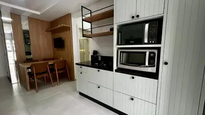 A cozinha ou kitchenette de apartamento praia de Palmas angel 202