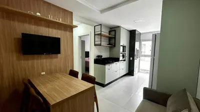 Uma televisão e/ou sistema de entretenimento em apartamento praia de Palmas angel 202