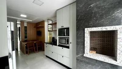 A cozinha ou kitchenette de apartamento praia de Palmas angel 202
