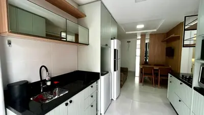 A cozinha ou kitchenette de apartamento praia de Palmas angel 202