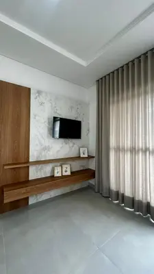 Uma televisão e/ou sistema de entretenimento em apartamento praia de Palmas angel 303