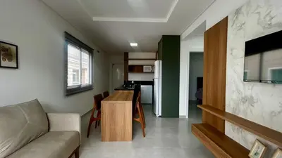 Uma televisão e/ou sistema de entretenimento em apartamento praia de Palmas angel 303
