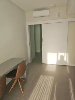 Uma área de estar em Suite privada en Four Seasons Residence monoambiente