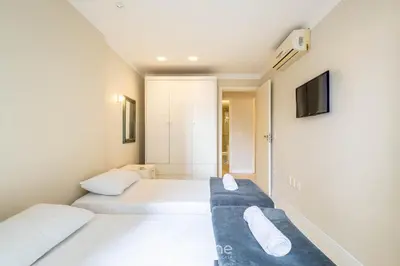 Uma cama ou camas num quarto em Apartamentos a 100m da Praia em BC - ERM