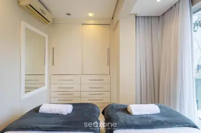 Uma cama ou camas num quarto em Apartamentos a 100m da Praia em BC - ERM