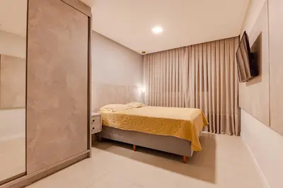 Uma cama ou camas num quarto em Aconchegante Apto em Condominio com Piscina