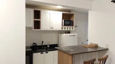 A cozinha ou kitchenette de Apartamento no coração da praia de Bombas