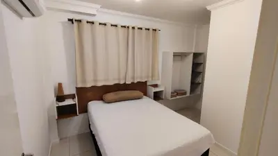 Uma cama ou camas num quarto em Apartamento no coração da praia de Bombas