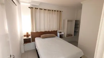 Uma cama ou camas num quarto em Apartamento no coração da praia de Bombas