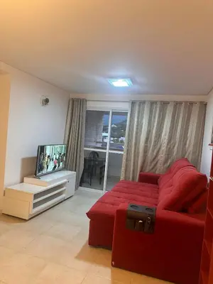 Uma área de estar em Apartamento na praia de Palmas