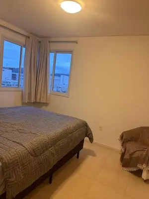Uma cama ou camas num quarto em Apartamento na praia de Palmas