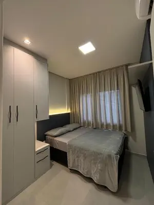 Uma cama ou camas num quarto em Apartamento Praia de Palmas