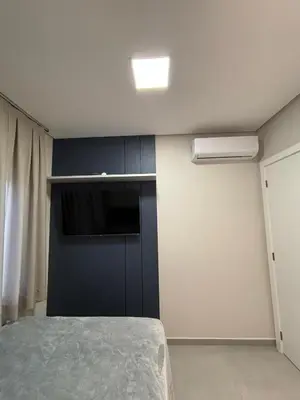 Uma cama ou camas num quarto em Apartamento Praia de Palmas