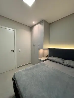 Uma cama ou camas num quarto em Apartamento Praia de Palmas