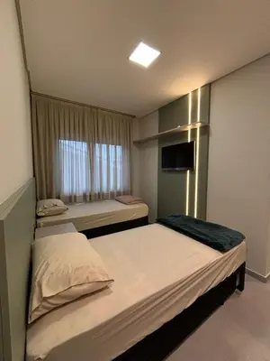 Uma cama ou camas num quarto em Apartamento Praia de Palmas