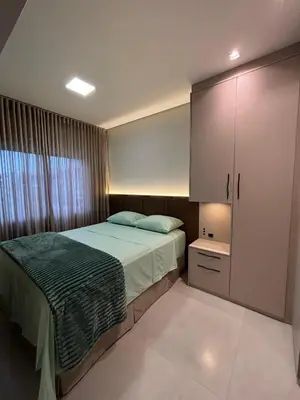 Uma cama ou camas num quarto em Apartamento Praia de Palmas