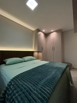 Uma cama ou camas num quarto em Apartamento Praia de Palmas