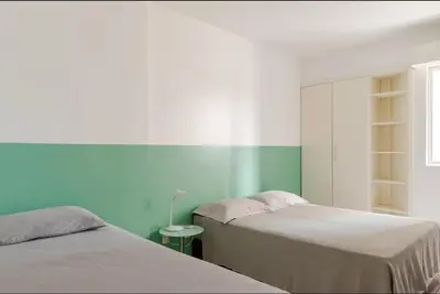 Uma cama ou camas num quarto em Lindo apto beira mar com garagem e internet