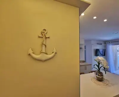 Uma televisão e/ou sistema de entretenimento em 504 - Apartamento Novo à 300 metros do mar em Itapema