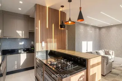 A cozinha ou kitchenette de Aptos em prédio a 90 m da praia de Perequê - RIHs