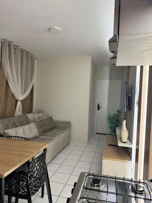 Uma área de estar em Apartamento dois quartos Aconchegante e bem localizado